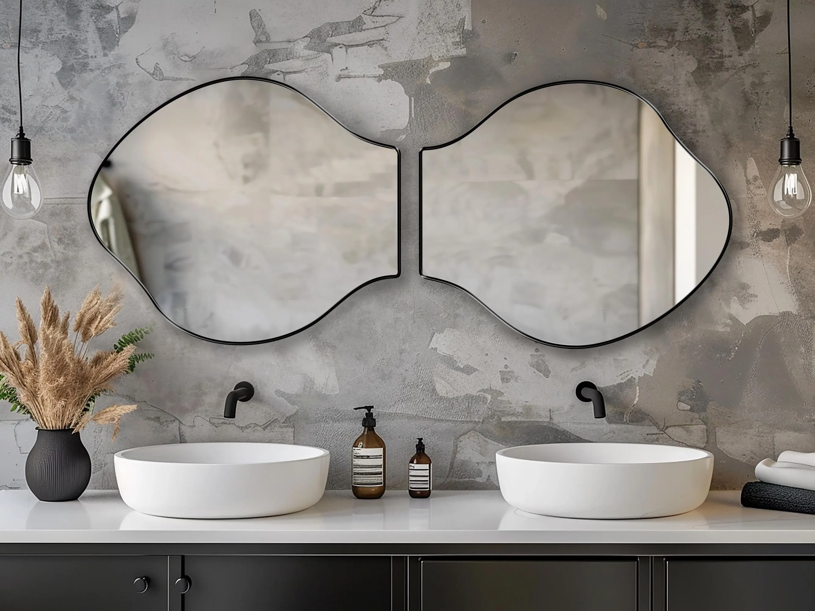 Two Pisces mirrors with black frame finish hung on the wall of a bathroom over a double vanity.