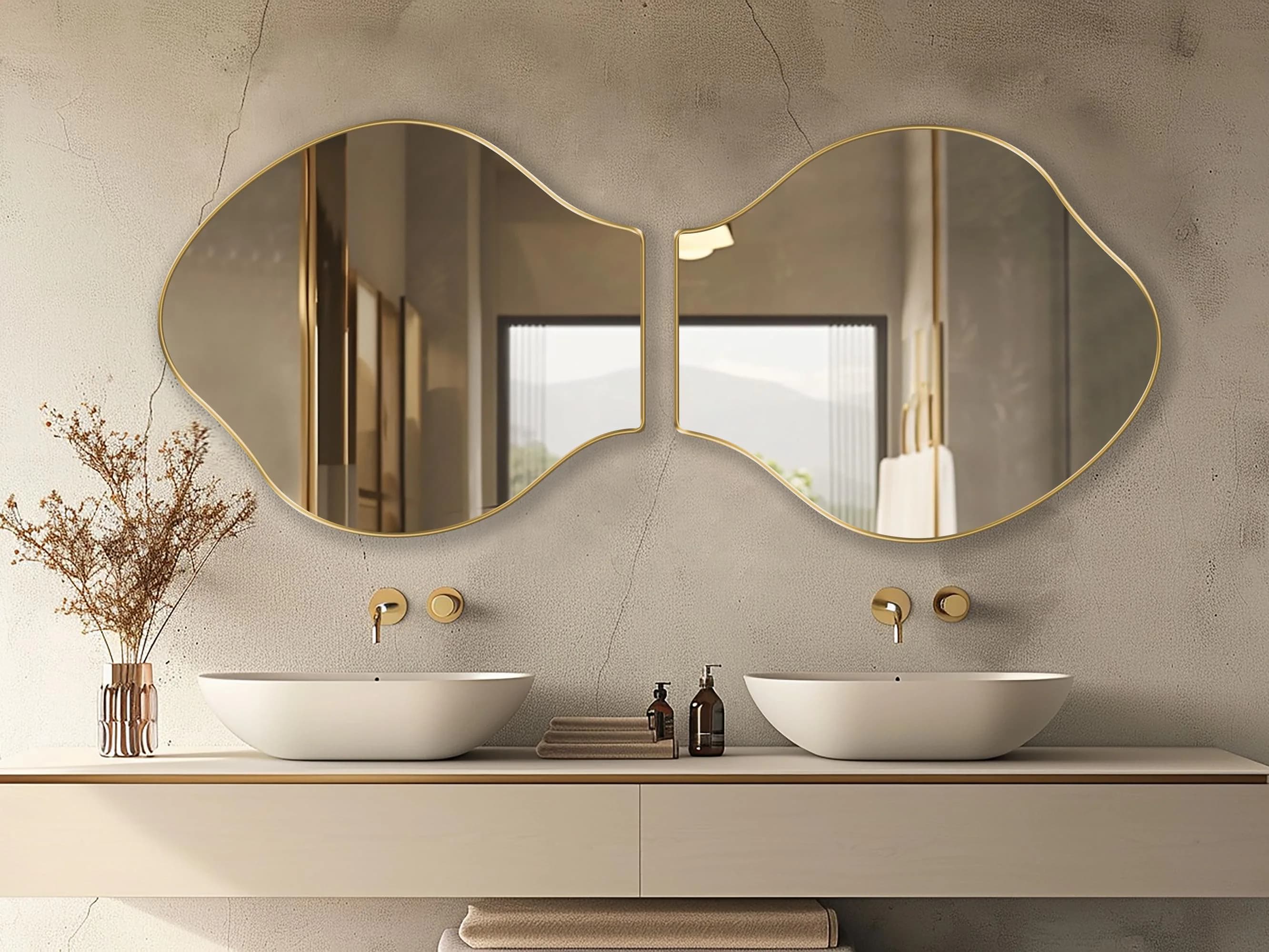 Two Pisces mirrors with gold frame finish hung on the wall of a bathroom over a double vanity.