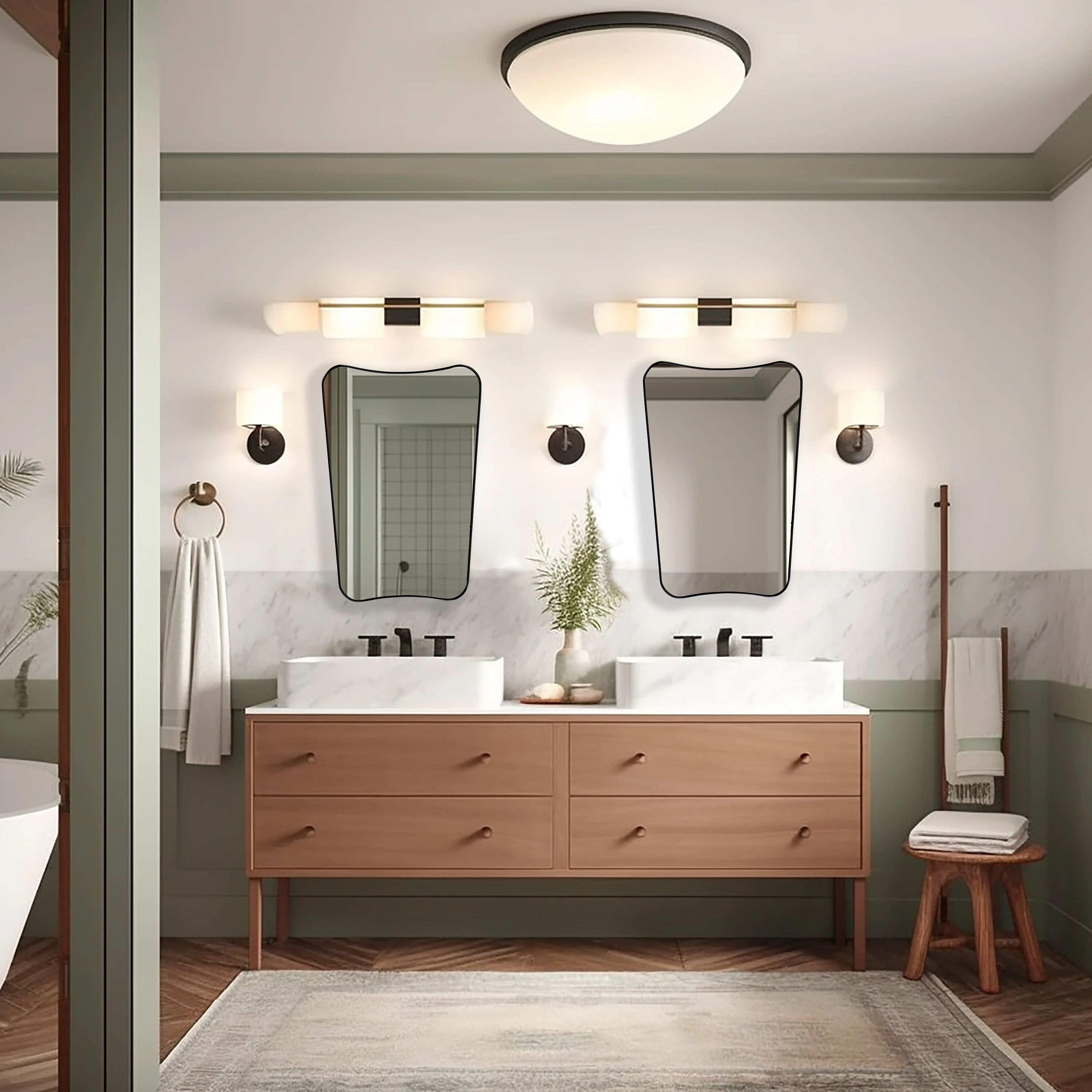 Two Italian style mirrors with black frame hung on a bathroom wall.