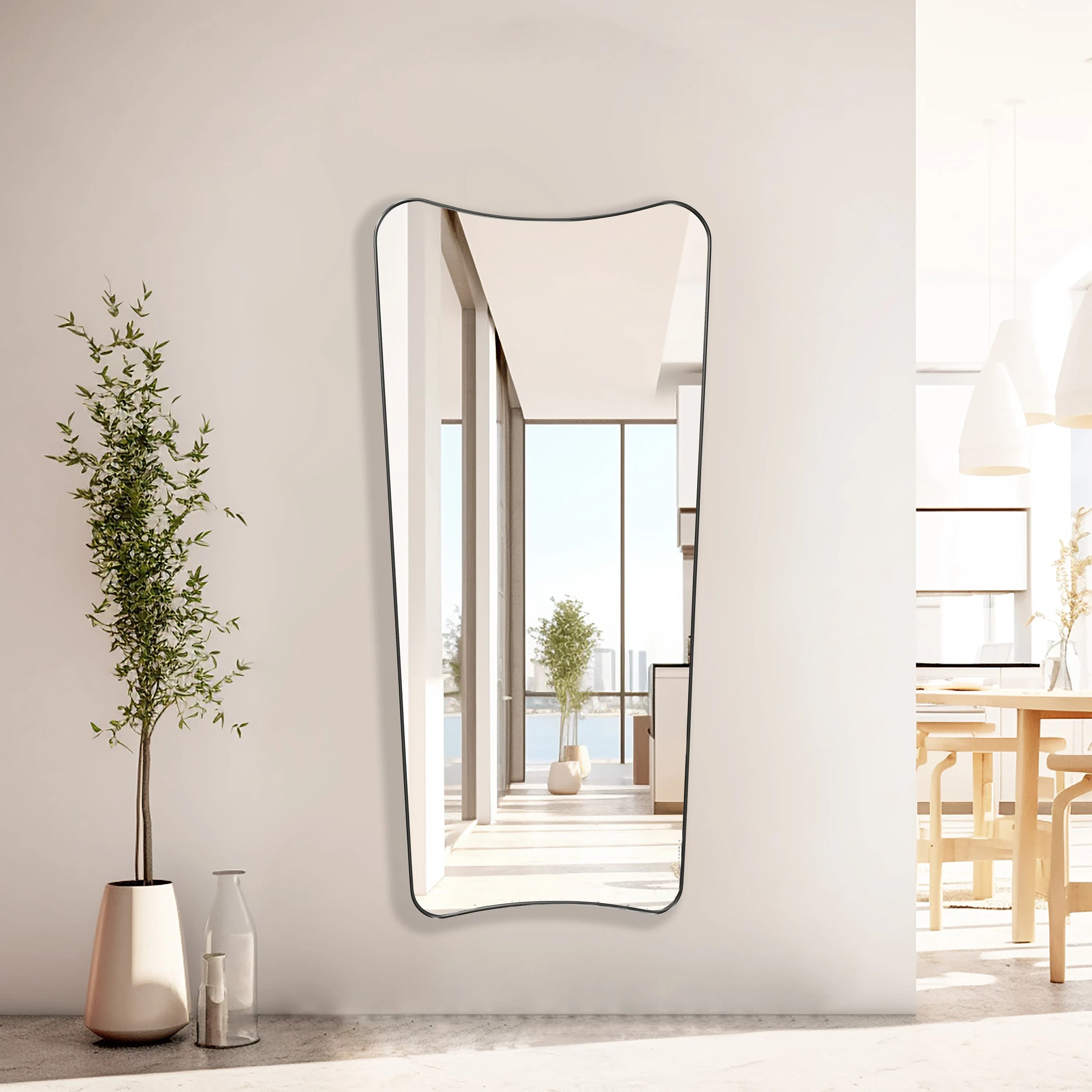 Italian style Full Length Mirror with black frame hung on an entryway wall.