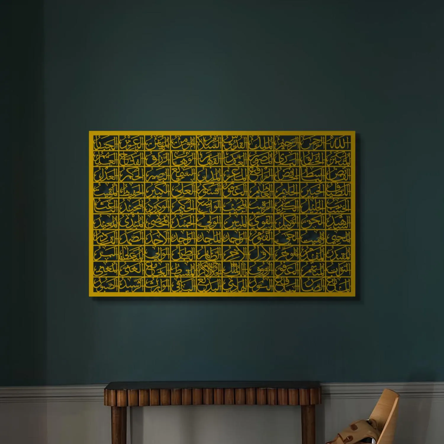 May include: A gold-colored wall art piece with intricate Arabic calligraphy in a square shape, hanging on a dark blue wall above a blue velvet sofa with gold throw pillows.