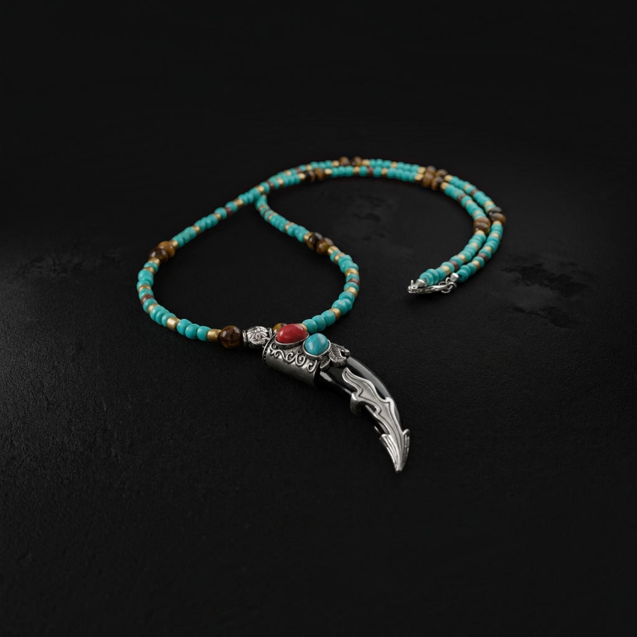 Nepali style tusk pendant necklace with turquoise howlite heishi beads, southwestern mens jewelry displayed on gray stone surface