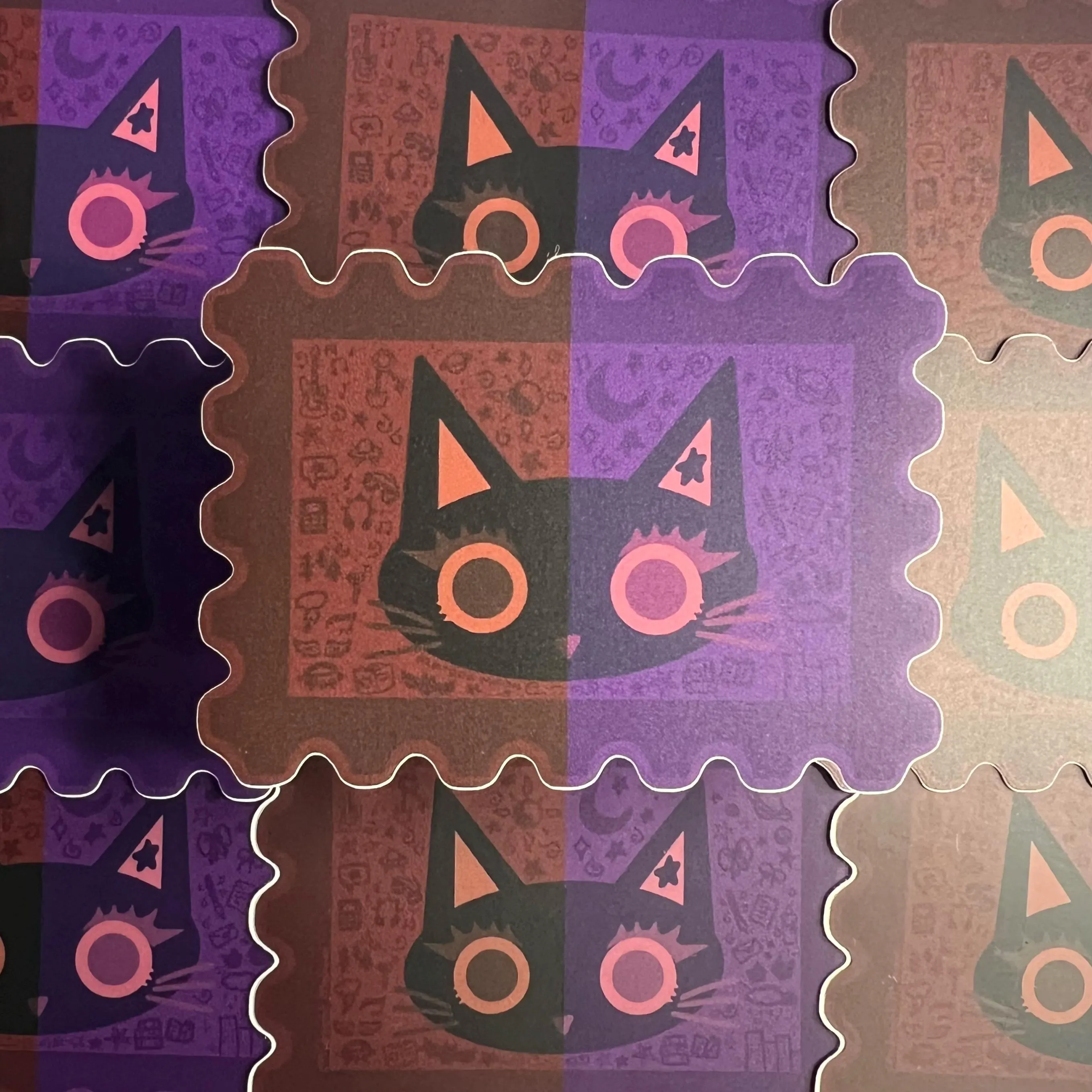 dual colored maroon and dark purple stamp black cat sticker