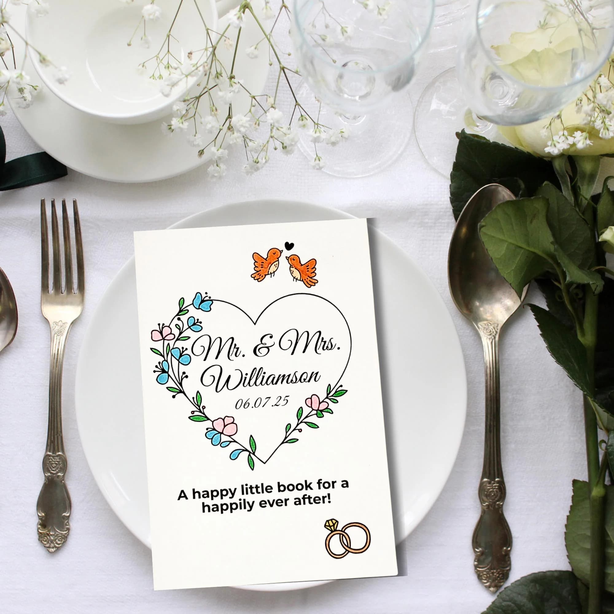 Personalized kids wedding activity book on a plate at a romantic wedding table setting with pink ribbon and cutlery with text perfect for the kids table keep kids happy on your big day.