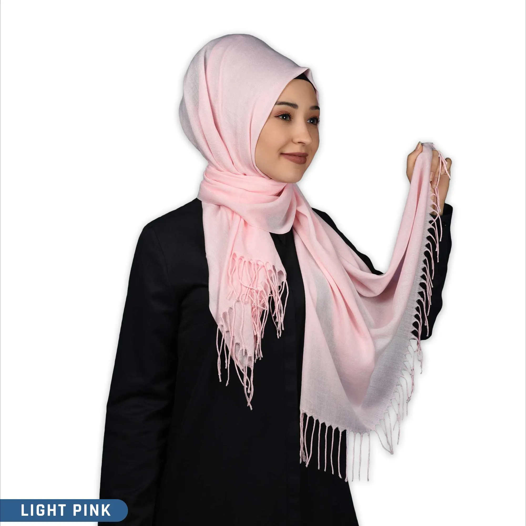 A light pink pashmina scarf with fringe trim. The hijab is made of a soft, lightweight fabric.