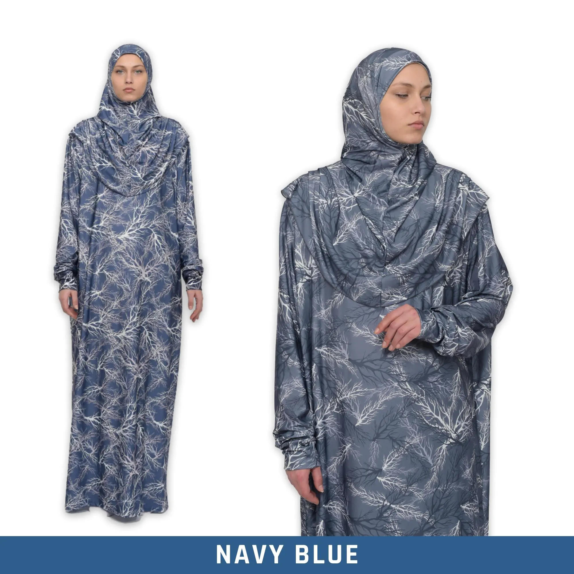 A navy blue prayer dress with a white tree branch pattern. The dress has long sleeves and a hood. The dress is made of a soft, comfortable fabric.