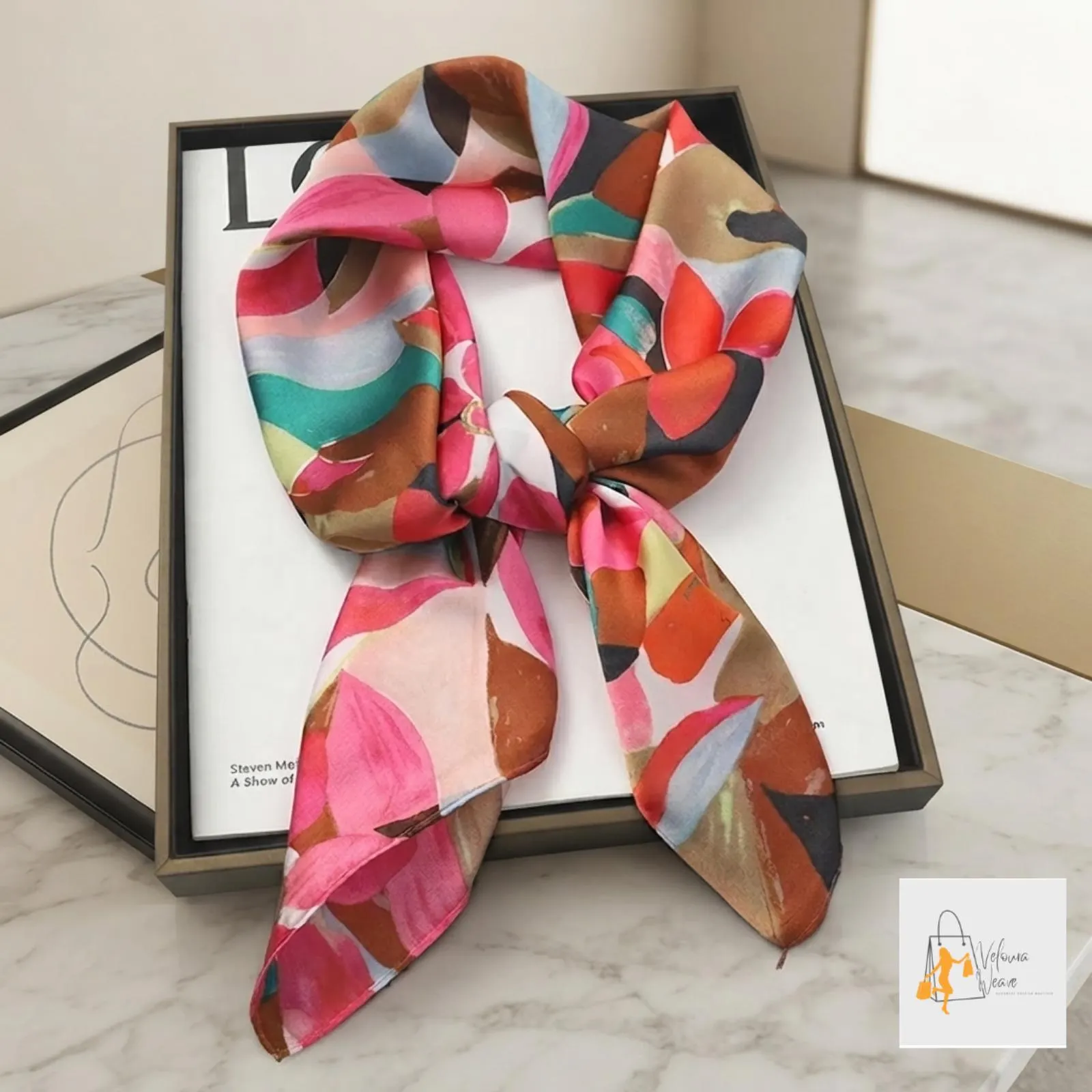 Close-up of the smooth satin fabric and detailed printed design.