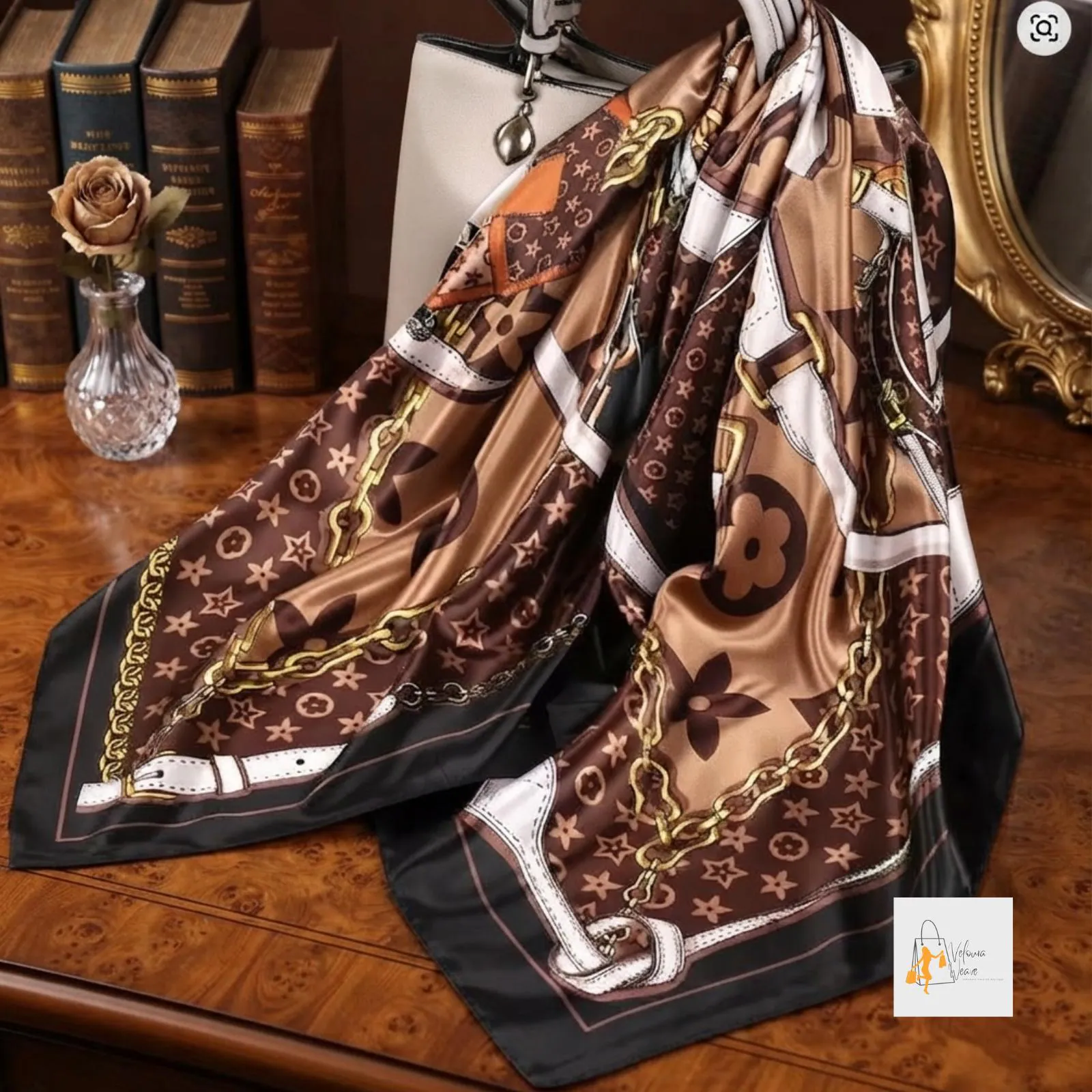 Black and white striped square scarf folded neatly on a flat surface.