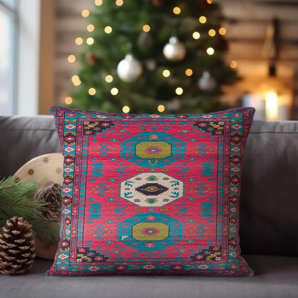 A vibrant, patterned throw pillow sits on a couch, with a blurred Christmas tree and twinkling lights in the background.