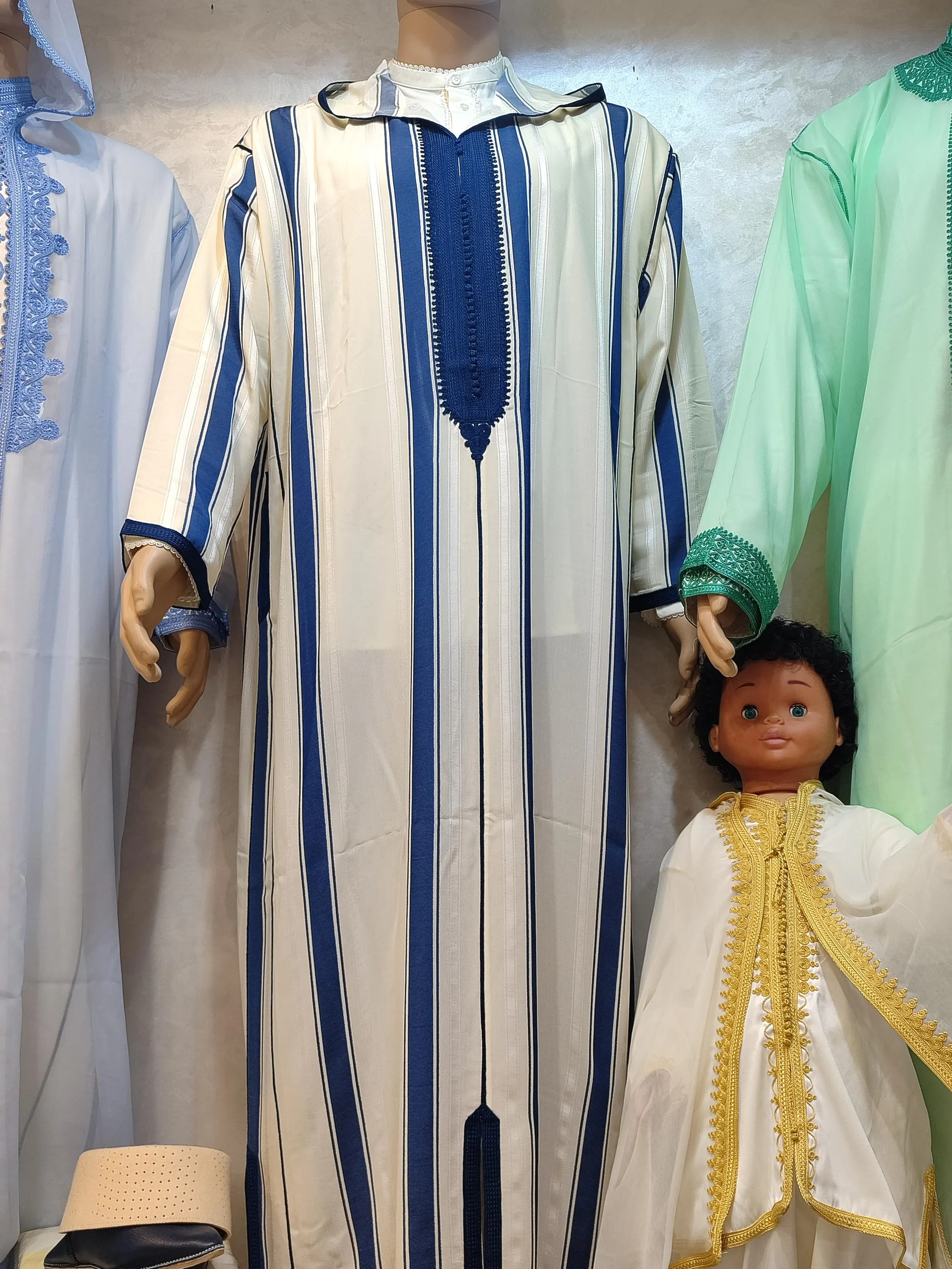 This substantial wool jalabiya men garment is designed for those who appreciate authentic Moroccan thobe traditions. Made from high-quality wool, this wool djellaba provides exceptional warmth while maintaining the elegant drape expected of traditional djellaba designs. The mens hooded thobe features a gracefully draped hood and traditional Moroccan buttons along the chest. Perfect as a thobe for men attending nikah dress ceremonies, Friday prayers