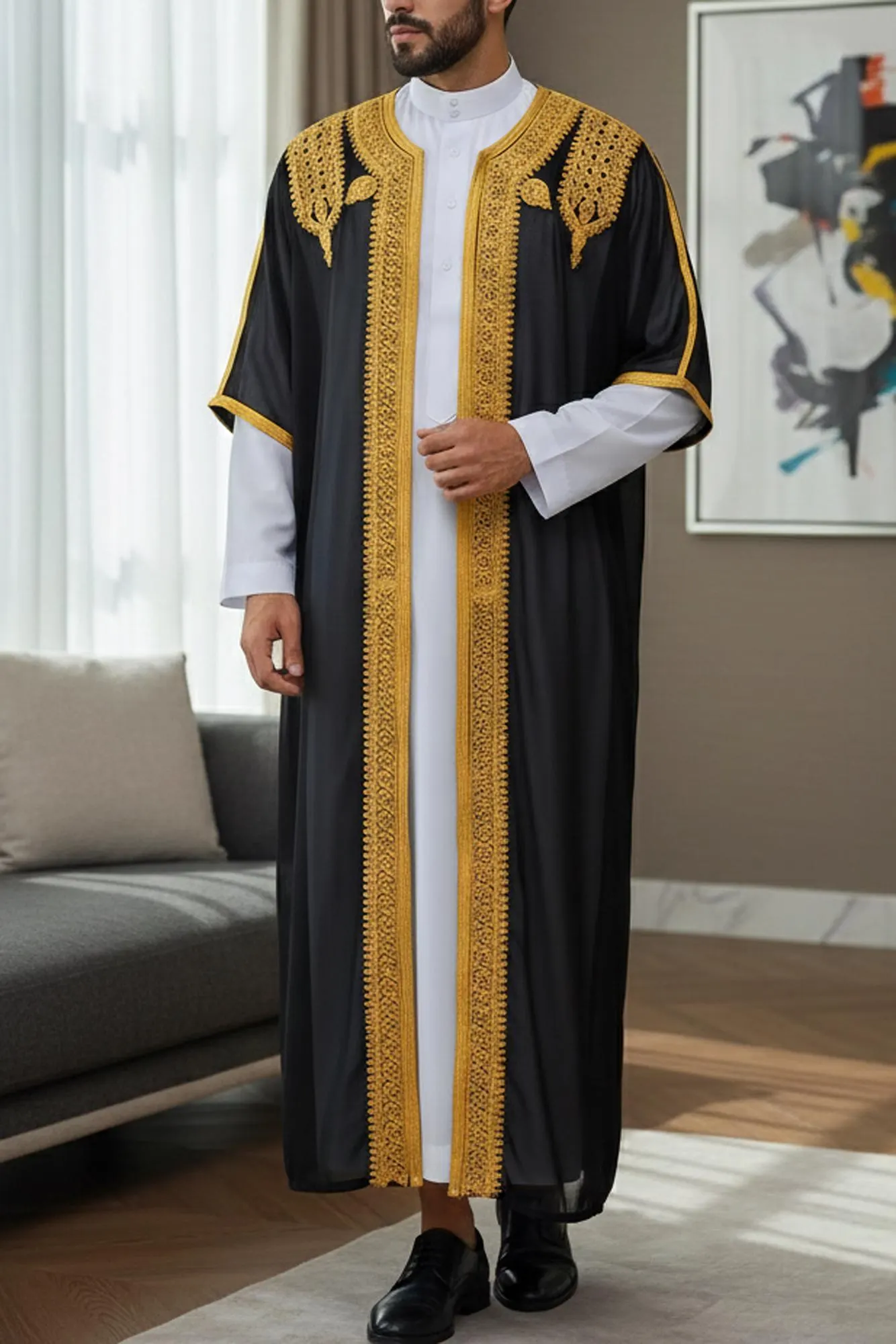 A man wearing a long-sleeve thobe with intricate embroidery on the stand collar and chest area, showcasing a loose-fit ethnic silhouette