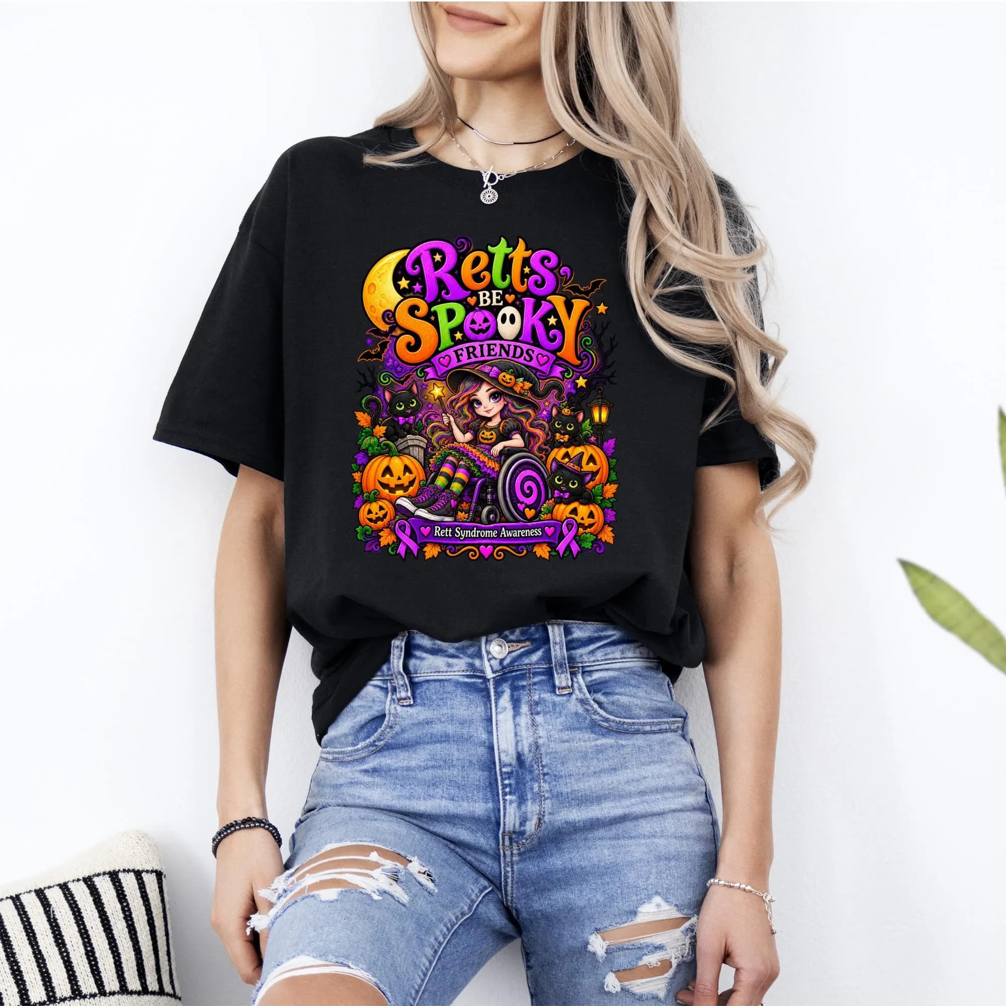 Halloween graphic t-shirt with "Retts Be Spooky Friends" and Rett Syndrome awareness ribbons.