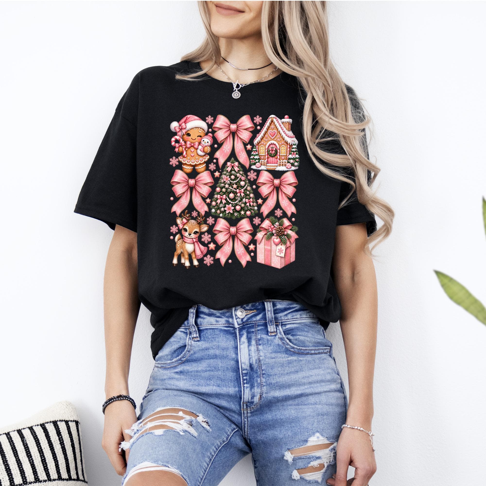 Black t-shirt with a Christmas-themed graphic featuring gingerbread man, tree, house, deer, and gifts.