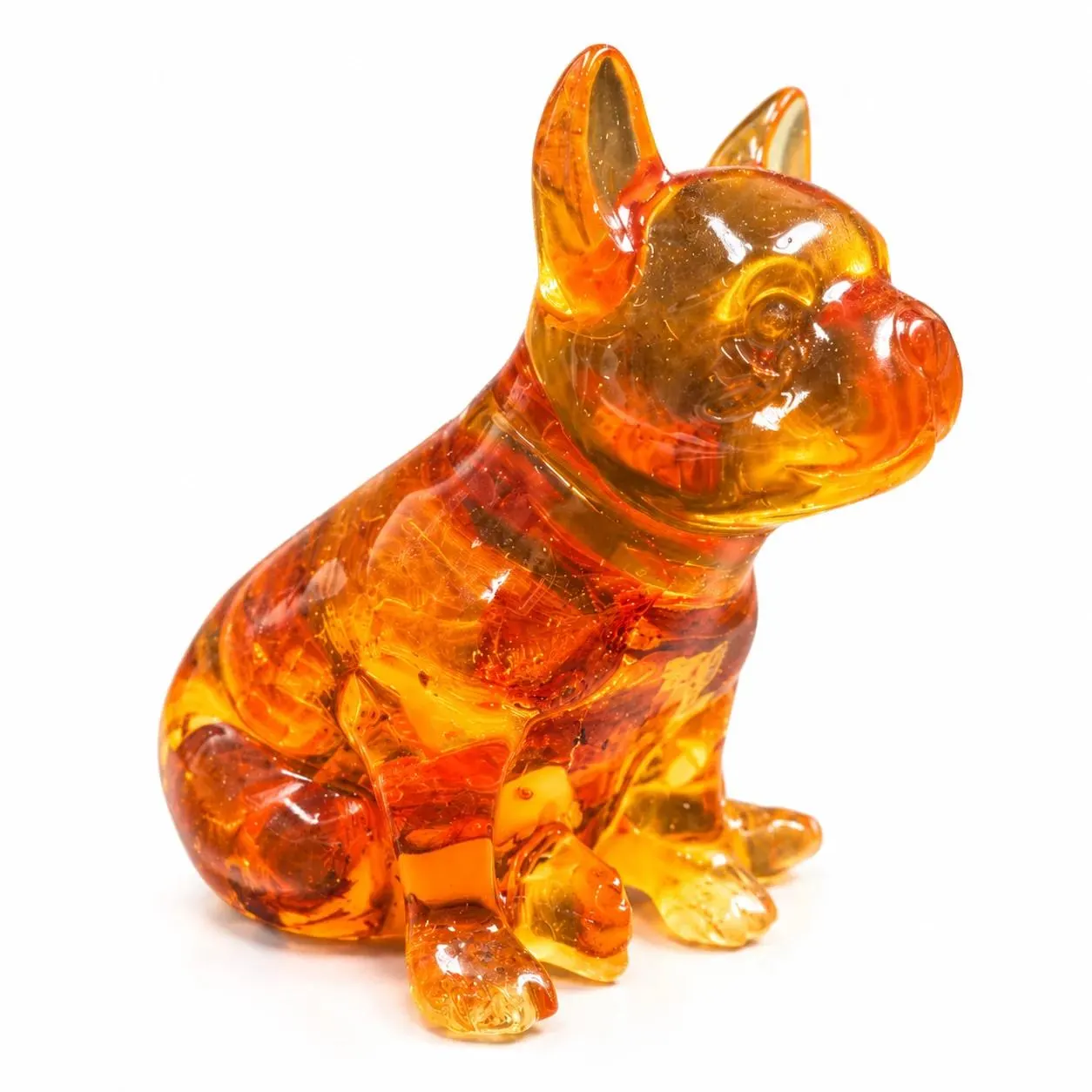 Made in USA natural Baltic amber sitting French Bulldog figurine on white background — translucent honey-cognac Frenchie with natural amber banding, KIZIMA® Brooklyn NY