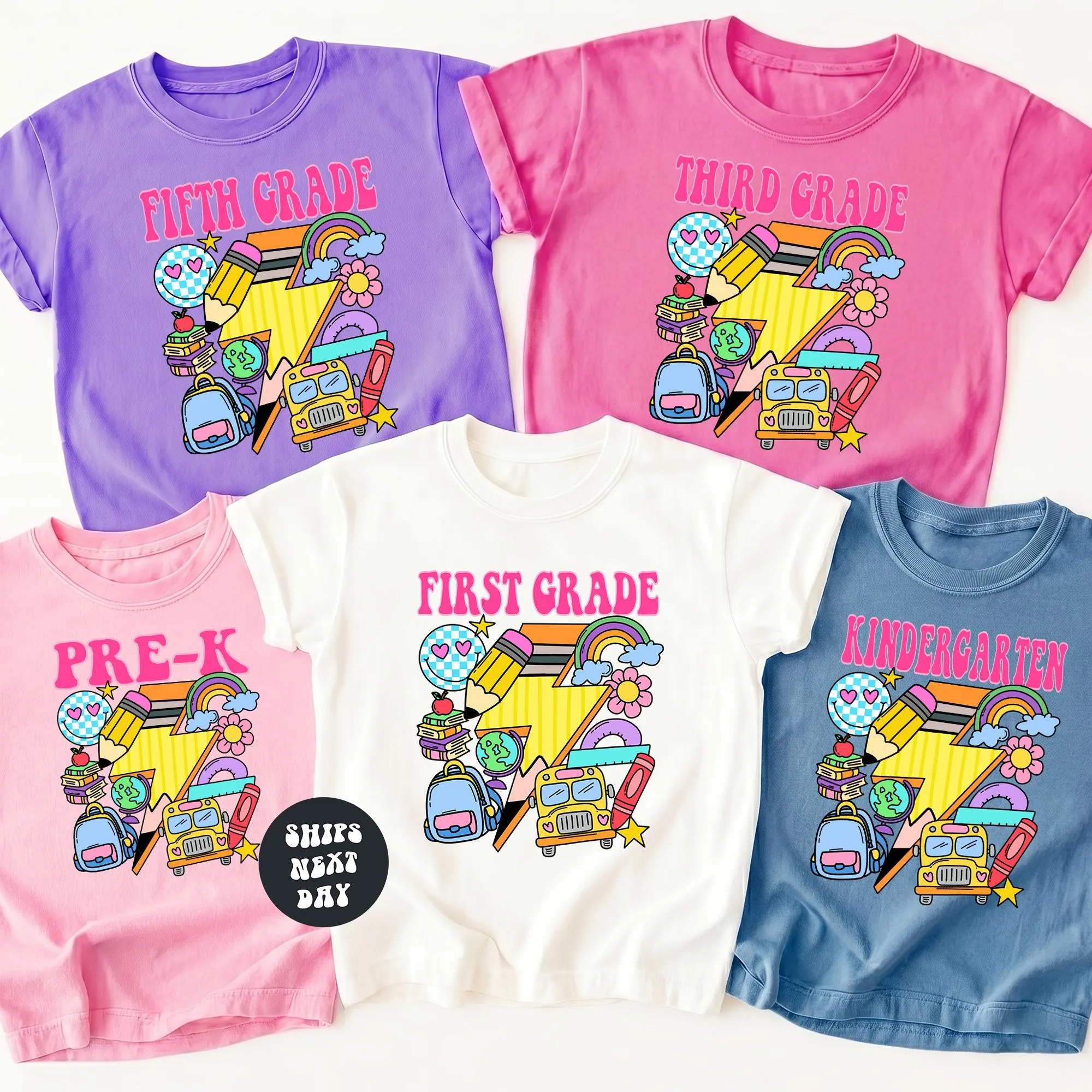 a collection of colorful t-shirts, each with a different design and color scheme, representing different grade levels: fifth, third, and first.