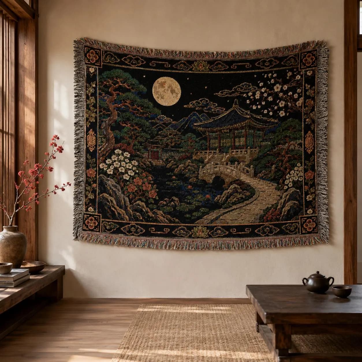Korean palace tapestry wall hanging on a white background, showing a moonlit traditional garden with tiled pavilion, stone bridge, pond, pine tree, white blossoms, mountains, woven texture, and fringed edges.