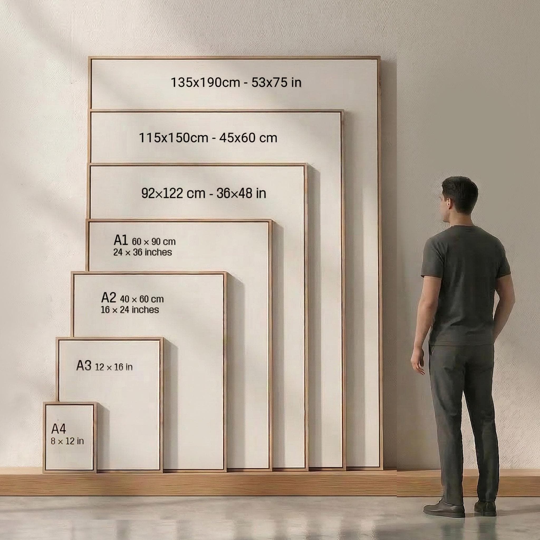 A man in a suit standing next to a large wooden frame with measurements for different sizes of frames.