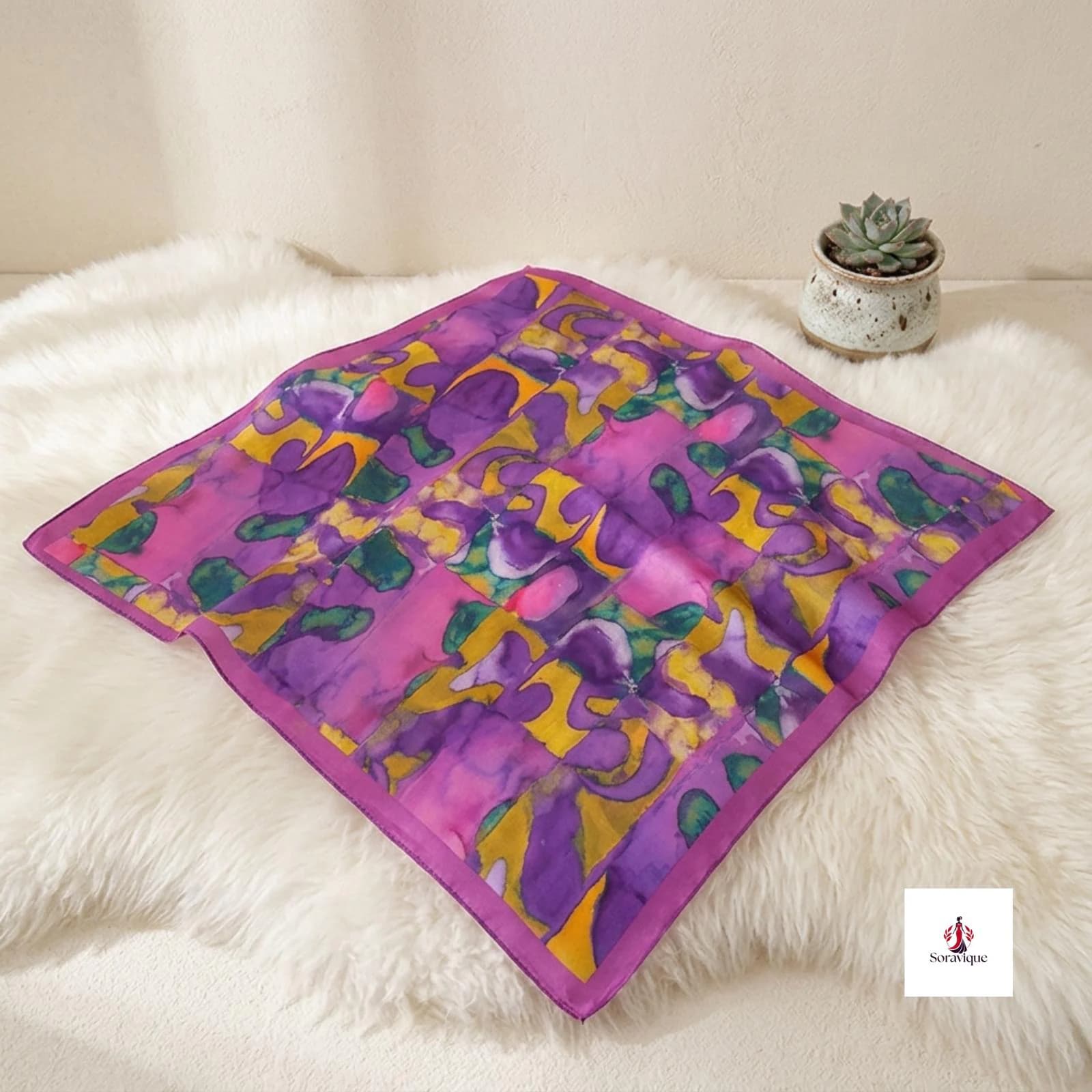 Printed hair scarf worn with a casual outfit.