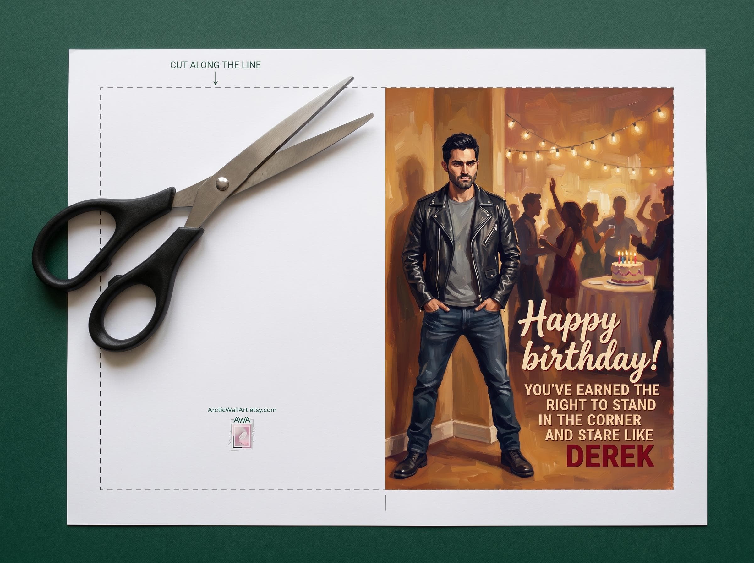 Postcard digital layout of the introvert birthday card before cutting: a dashed cut line around the card, a blank back panel with a small ArcticWallArt mark, and a front with Derek Hale brooding in the corner in his leather jacket, with the text Happy birthday! You've earned the right to stand in the corner and stare like Derek. Print, cut and fold into a 5 x 7 inch werewolf card.