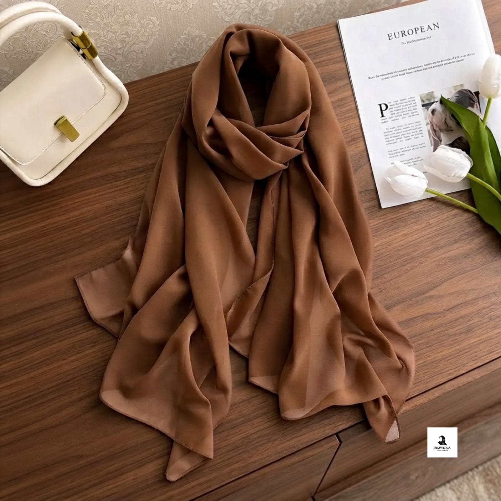 Close-up showing the smooth texture and neat stitching of the chiffon scarf.