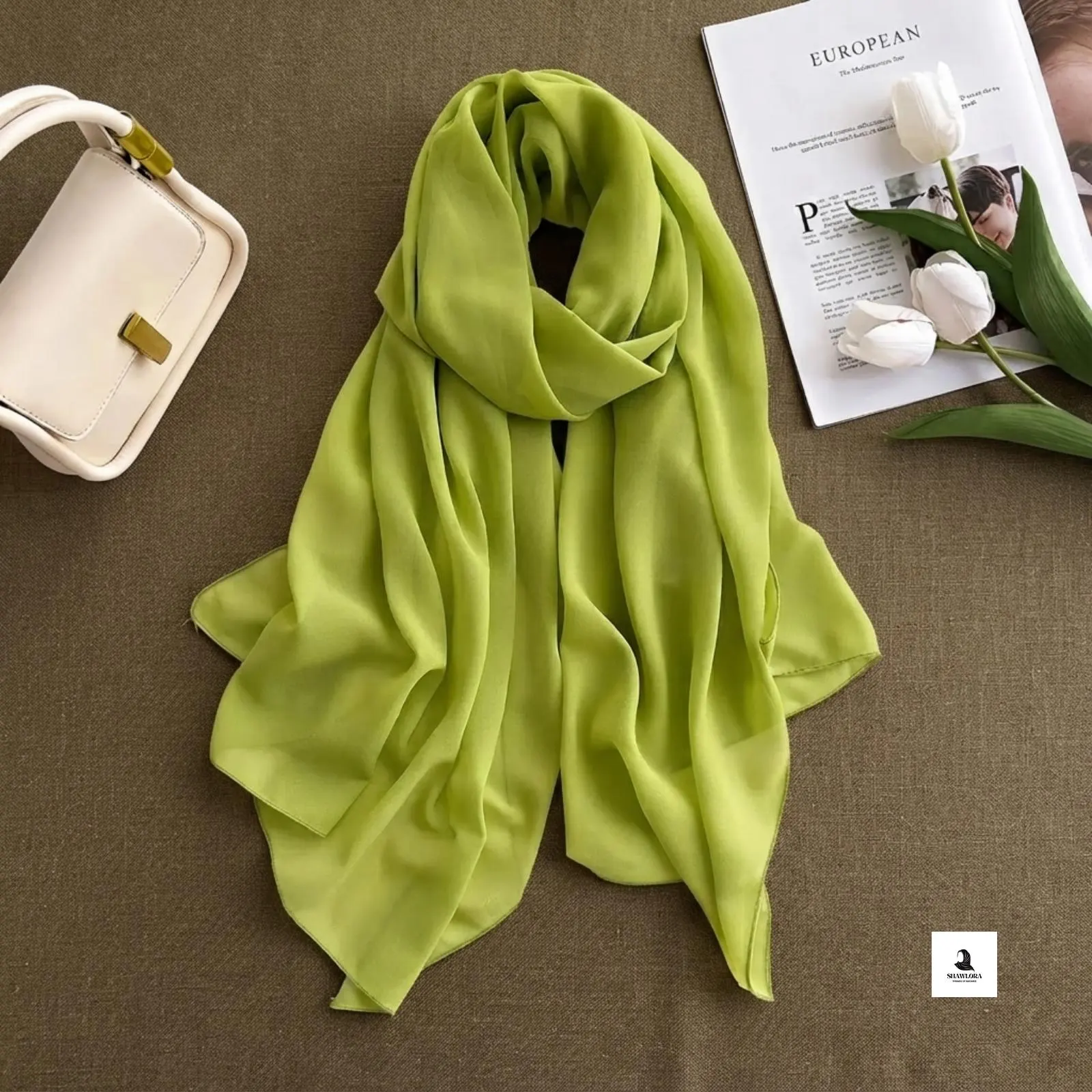 Woman wearing a lightweight plain chiffon hijab styled as an elegant everyday wrap.