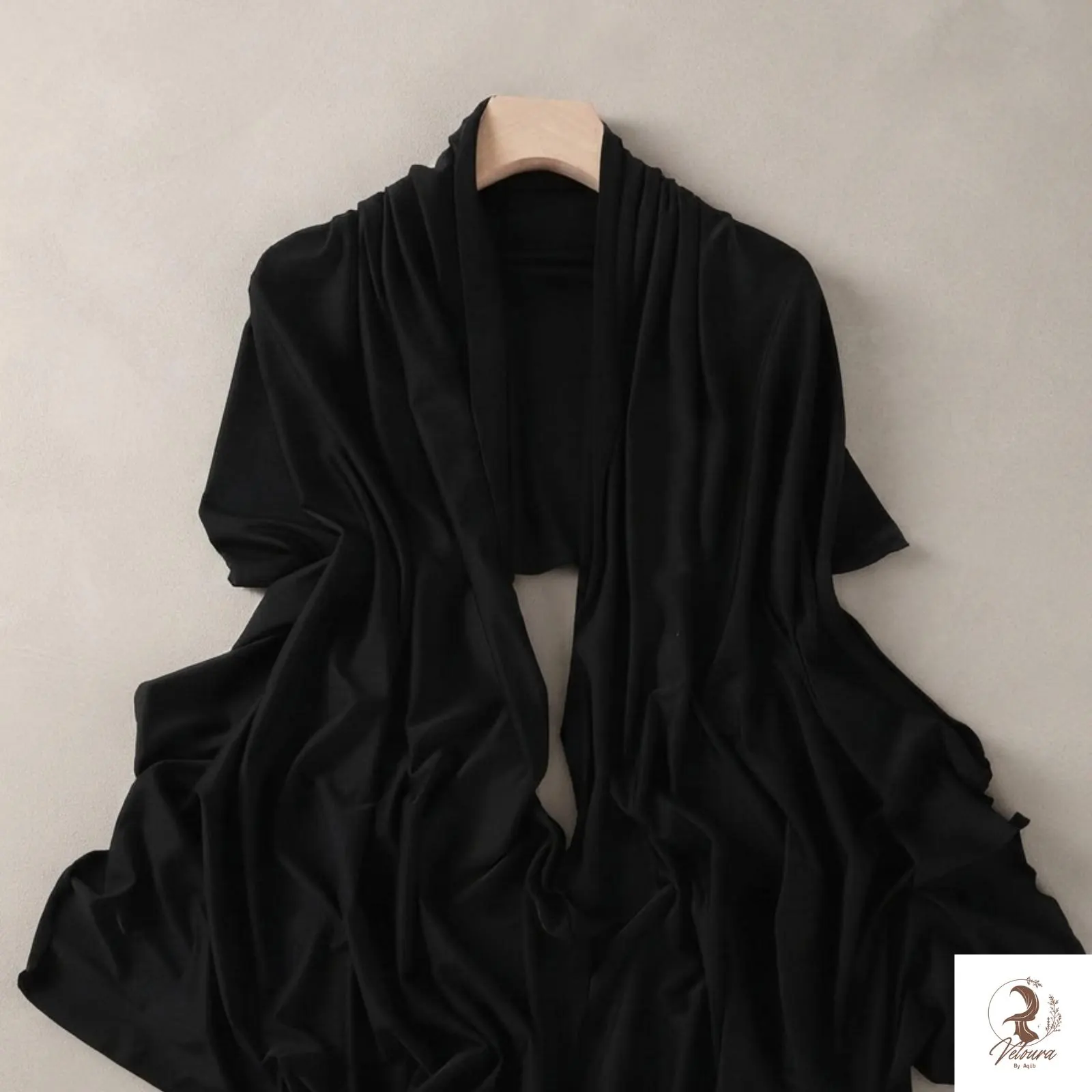 Close-up of the hijab fabric showing its visible texture and drape.
