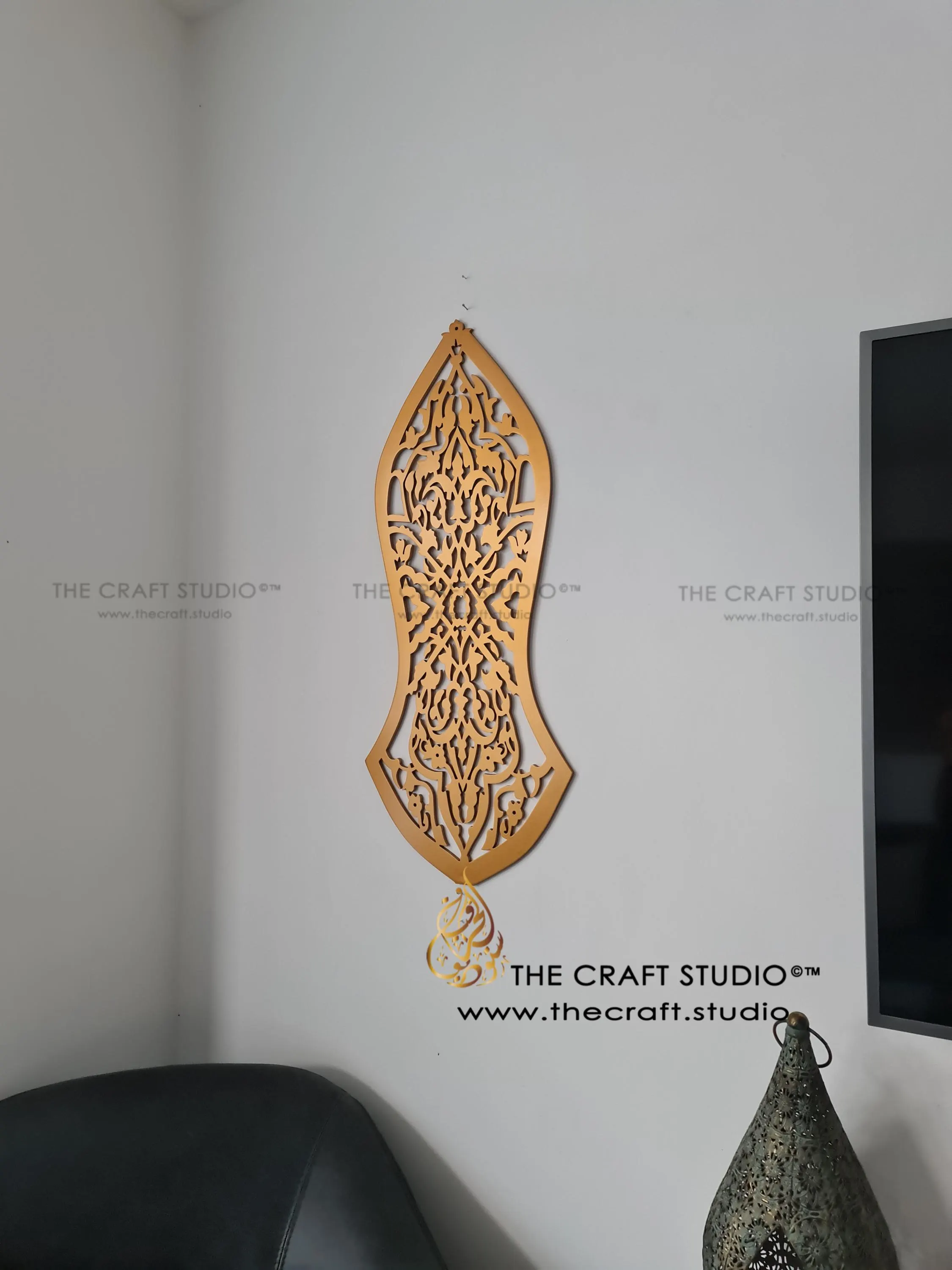 Intricately hand carved arabesque pattern in shape of the nalayn prophetic sandal. Finished in antique gold. Hanging on a wall