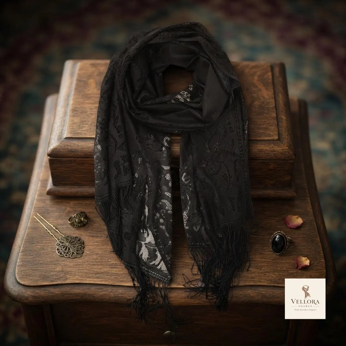 Black yellow and pink scarf displayed against a neutral background