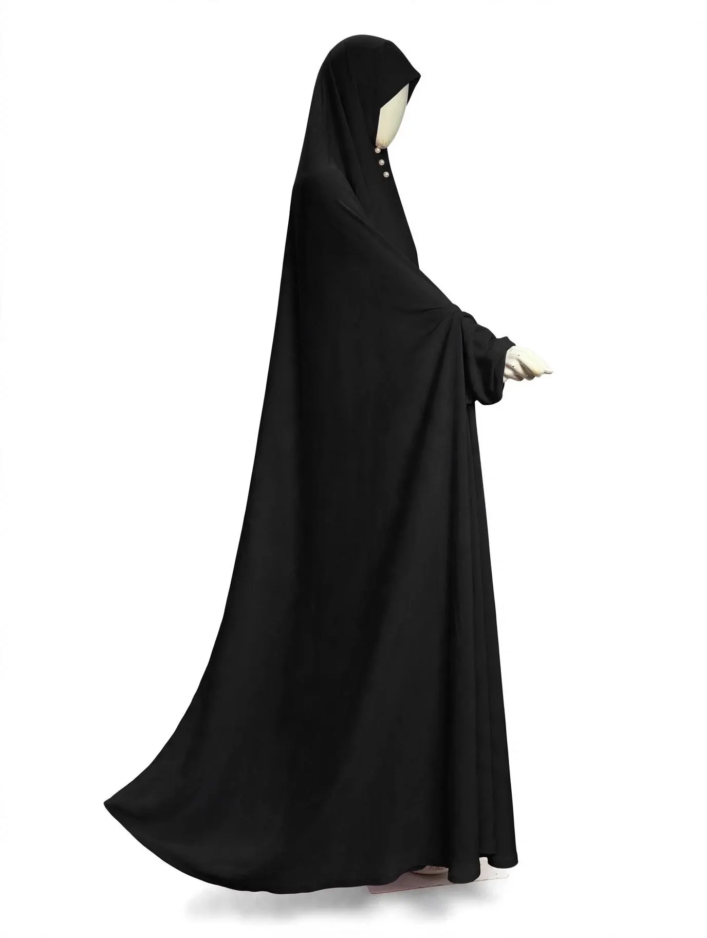 A solid black prayer gown featuring a floor-length, loose-fitting silhouette with long sleeves. The garment includes a matching integrated head covering and a vertical row of three small, white pearl buttons at the neckline.